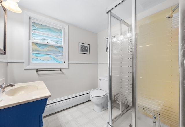 97 Forest Ave, Orono, ME 04473 - bathroom with a baseboard radiator, vanity, a stall shower, and tile patterned floors