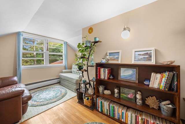 97 Forest Ave, Orono, ME 04473 - living area featuring a baseboard radiator, wood finished floors, and lofted ceiling
