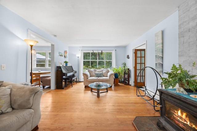 97 Forest Ave, Orono, ME 04473 - living area featuring light wood-style floors and a glass covered fireplace