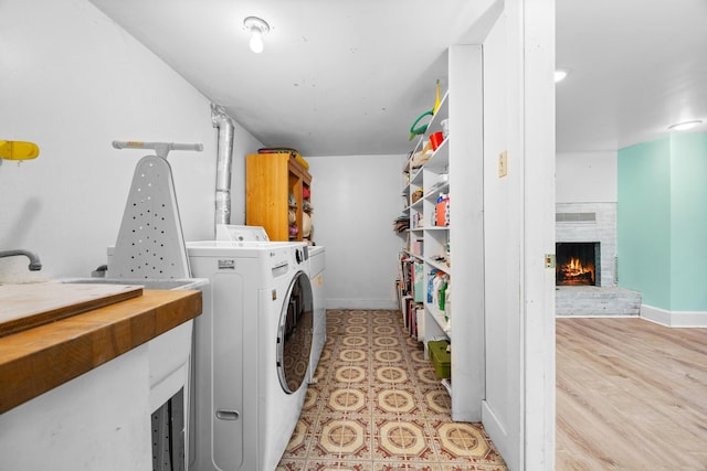 97 Forest Ave, Orono, ME 04473 - washroom with a brick fireplace and independent washer and dryer