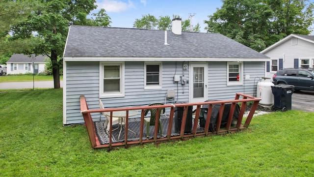 119 Falvey St, Bangor, ME 04401 - rear view of property featuring a chimney, a yard, and a shingled roof