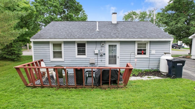 119 Falvey St, Bangor, ME 04401 - rear view of house featuring a chimney, a shingled roof, and a lawn