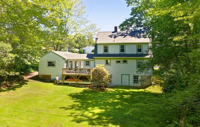 302 Townsend Ave, Boothbay Harbor, ME 04538 - back of house featuring a wooden deck, a yard, a chimney, and roof with shingles