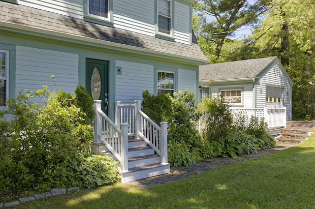 302 Townsend Ave, Boothbay Harbor, ME 04538 - entrance to property with roof with shingles and a lawn