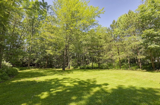 302 Townsend Ave, Boothbay Harbor, ME 04538 - view of grassy yard featuring a wooded view
