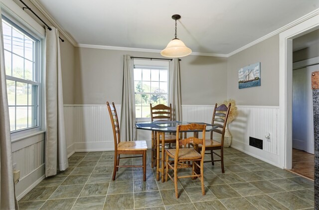 302 Townsend Ave, Boothbay Harbor, ME 04538 - dining area featuring a wainscoted wall, healthy amount of natural light, and ornamental molding