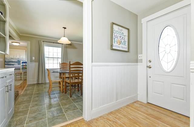 302 Townsend Ave, Boothbay Harbor, ME 04538 - foyer featuring a wainscoted wall and crown molding