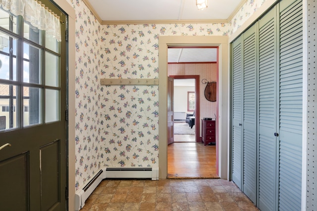 426 Meadow Rd, Topsham, ME 04086 - hall with wallpapered walls, healthy amount of natural light, crown molding, baseboard heating, and stone finish floors
