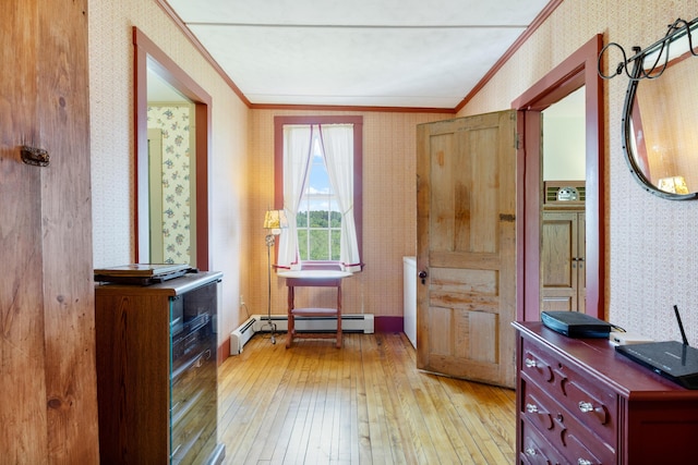 426 Meadow Rd, Topsham, ME 04086 - entryway with wallpapered walls, crown molding, a baseboard heating unit, and light wood-style floors