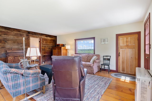 426 Meadow Rd, Topsham, ME 04086 - living room featuring light wood-type flooring and wooden walls