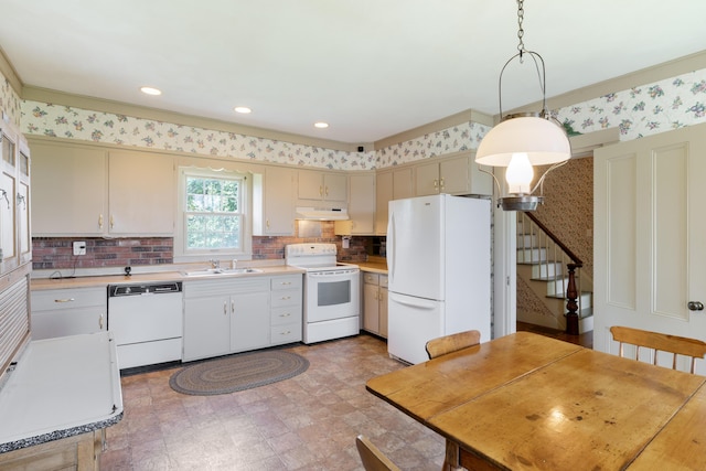426 Meadow Rd, Topsham, ME 04086 - kitchen with white appliances, under cabinet range hood, light countertops, decorative backsplash, and wallpapered walls