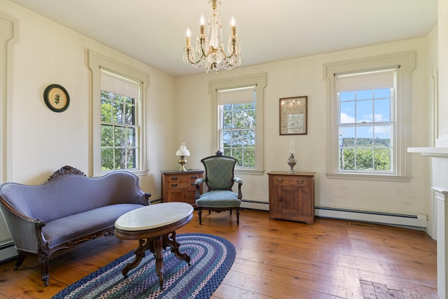426 Meadow Rd, Topsham, ME 04086 - sitting room with baseboard heating, a chandelier, and plenty of natural light