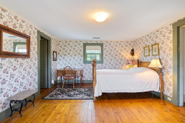 426 Meadow Rd, Topsham, ME 04086 - bedroom featuring wallpapered walls, hardwood / wood-style flooring, and ornamental molding