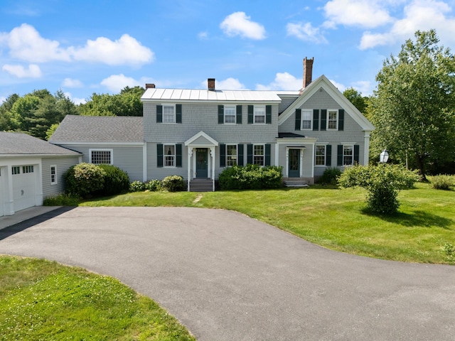 426 Meadow Rd, Topsham, ME 04086 - colonial inspired home featuring a chimney, asphalt driveway, a garage, and a front yard