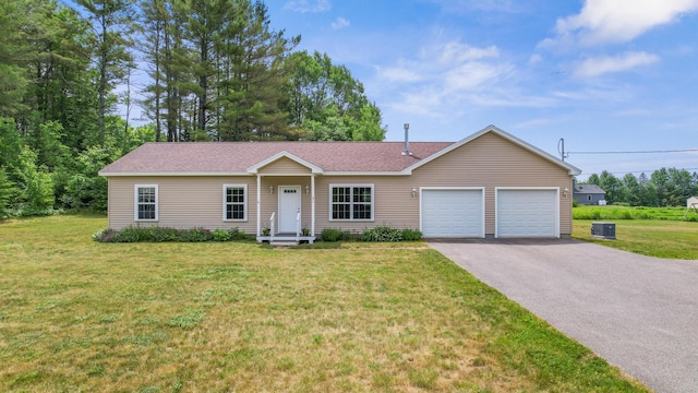 31 Silas Warren Dr, Hermon, ME 04401 - single story home with a garage, asphalt driveway, a front lawn, and a shingled roof