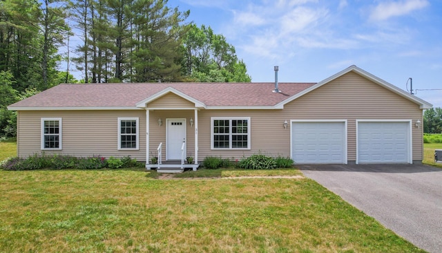 31 Silas Warren Dr, Hermon, ME 04401 - ranch-style home with an attached garage, driveway, a front yard, and a shingled roof
