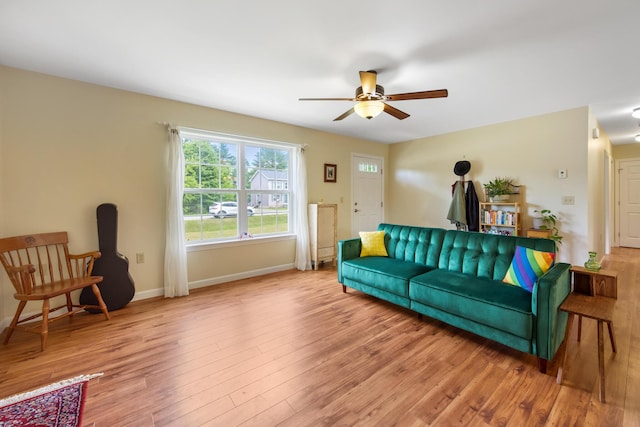 31 Silas Warren Dr, Hermon, ME 04401 - living area with ceiling fan and wood finished floors
