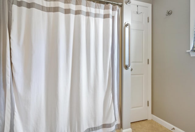 31 Silas Warren Dr, Hermon, ME 04401 - bathroom featuring curtained shower and tile patterned flooring