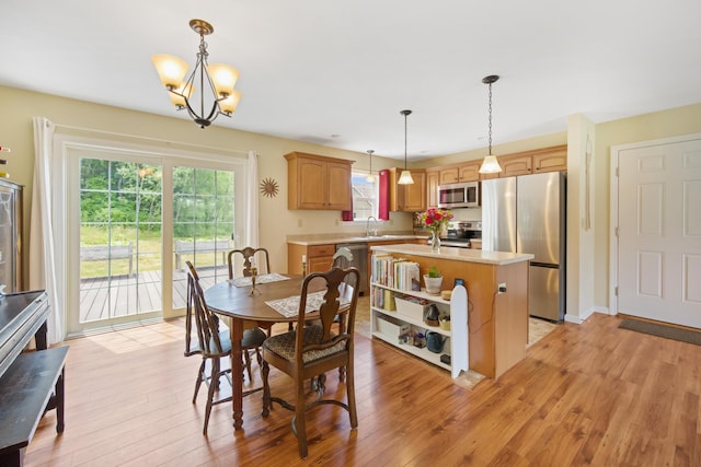 31 Silas Warren Dr, Hermon, ME 04401 - dining area with healthy amount of natural light, light wood-style flooring, and a chandelier