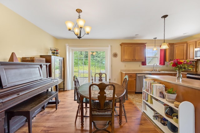 31 Silas Warren Dr, Hermon, ME 04401 - dining area with healthy amount of natural light, a chandelier, and light wood finished floors