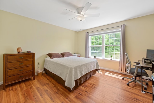 31 Silas Warren Dr, Hermon, ME 04401 - bedroom featuring wood finished floors, an office area, and a ceiling fan