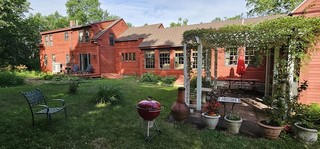 987 Clinton Ave, Winslow, ME 04901 - rear view of property with a pergola, a shingled roof, a yard, and a patio area
