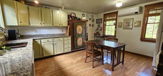 987 Clinton Ave, Winslow, ME 04901 - dining area featuring a wall mounted air conditioner and light wood-type flooring