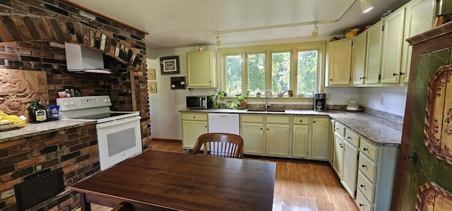 987 Clinton Ave, Winslow, ME 04901 - kitchen featuring white appliances, ventilation hood, light wood-type flooring, green cabinetry, and light stone countertops