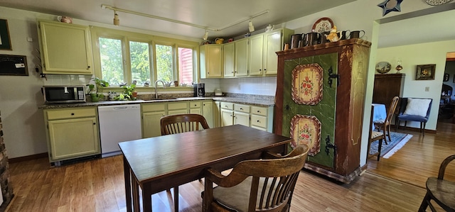 987 Clinton Ave, Winslow, ME 04901 - kitchen featuring dishwasher, stainless steel microwave, wood finished floors, and rail lighting