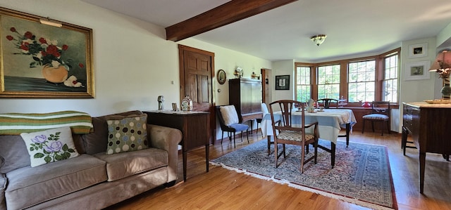 987 Clinton Ave, Winslow, ME 04901 - dining area featuring light wood-style floors and beam ceiling