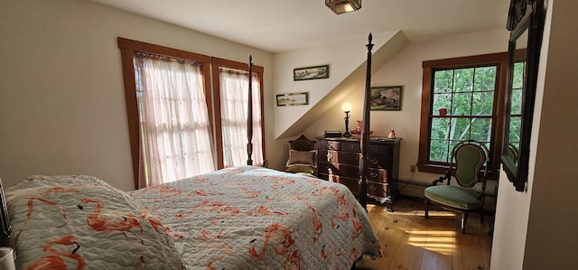 987 Clinton Ave, Winslow, ME 04901 - bedroom with multiple windows and wood-type flooring