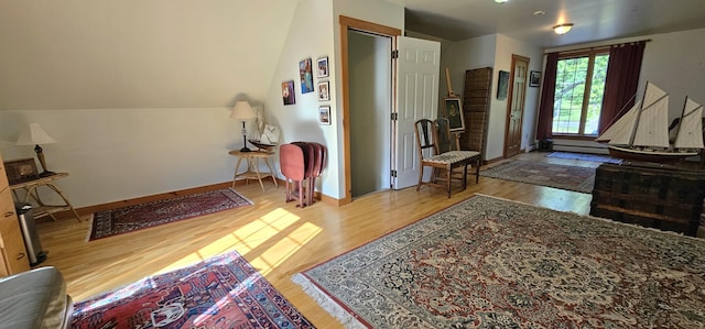 987 Clinton Ave, Winslow, ME 04901 - entrance foyer featuring wood finished floors and a baseboard radiator