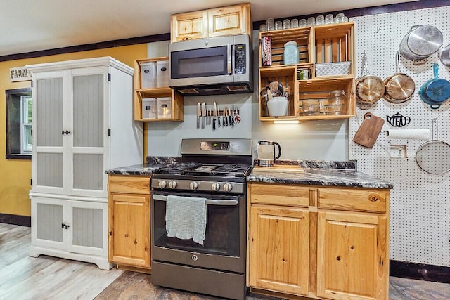 71 Morgan Rd, Burnham, ME 04922 - kitchen with appliances with stainless steel finishes, open shelves, and light wood-type flooring