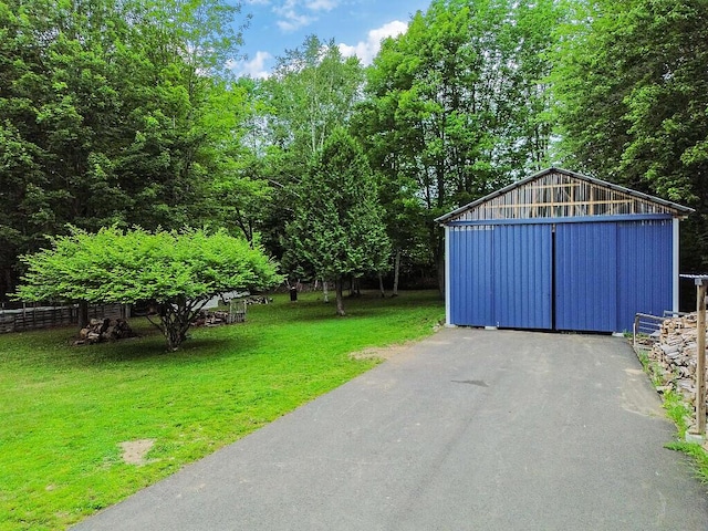 71 Morgan Rd, Burnham, ME 04922 - view of yard with a garage and an outbuilding