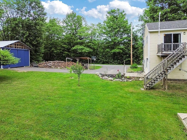 71 Morgan Rd, Burnham, ME 04922 - view of green lawn featuring stairs and an outbuilding