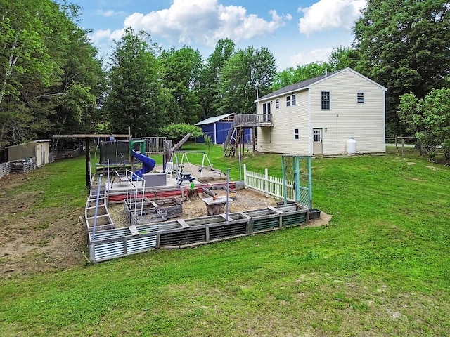 71 Morgan Rd, Burnham, ME 04922 - view of yard with a playground, a wooden deck, and view of scattered trees