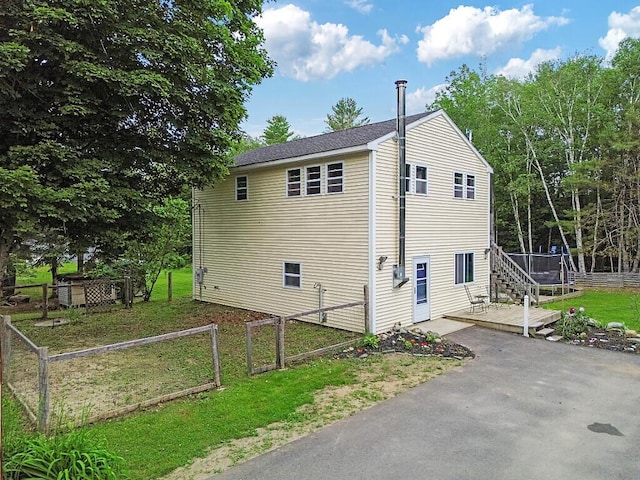 71 Morgan Rd, Burnham, ME 04922 - view of side of property featuring a deck and a patio area