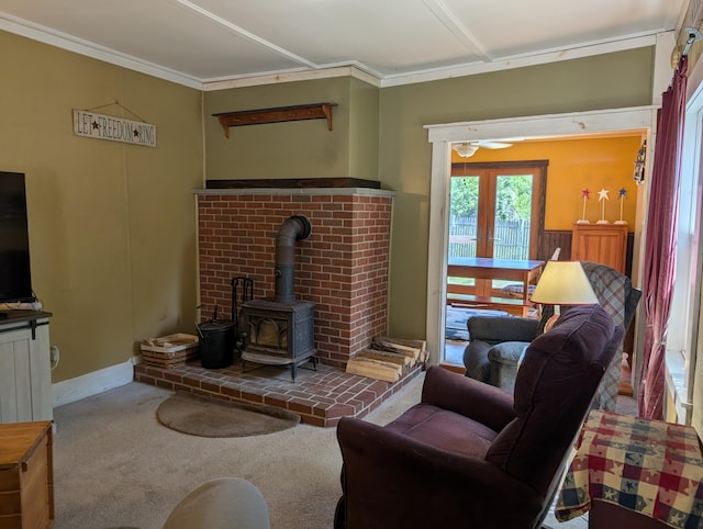 419 Common Rd, Union, ME 04862 - living area with a wood stove, carpet floors, and crown molding
