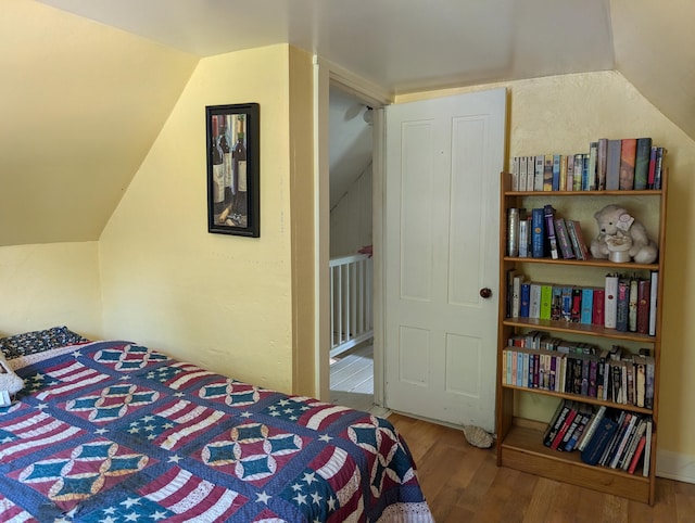 419 Common Rd, Union, ME 04862 - bedroom featuring lofted ceiling and wood finished floors