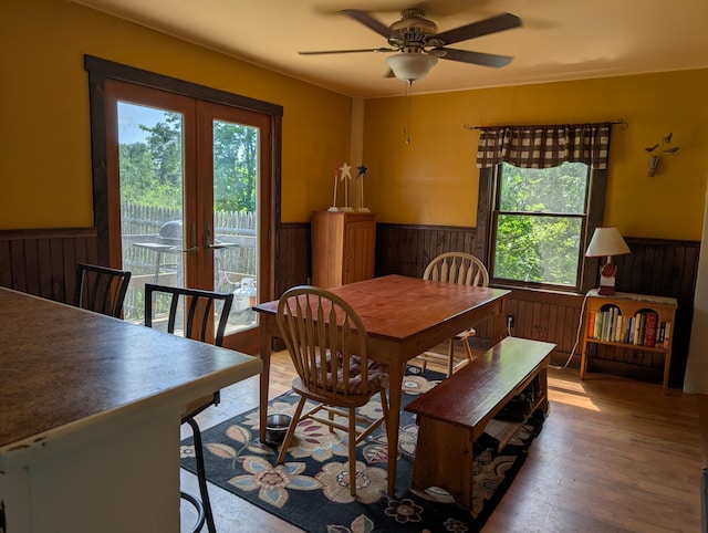 419 Common Rd, Union, ME 04862 - dining area with wainscoting, wooden walls, healthy amount of natural light, french doors, and a ceiling fan