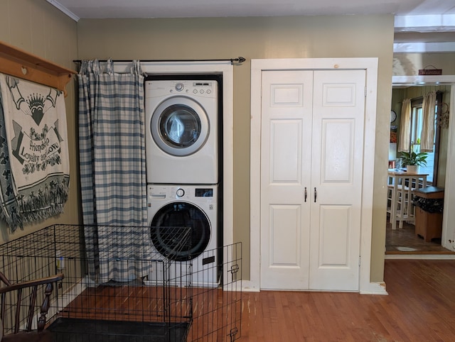 419 Common Rd, Union, ME 04862 - laundry area featuring stacked washer / dryer and wood finished floors