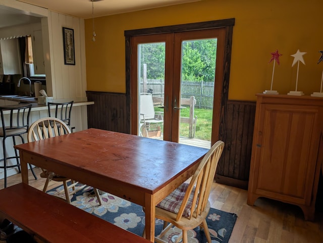 419 Common Rd, Union, ME 04862 - dining space featuring light wood finished floors, wainscoting, and wood walls