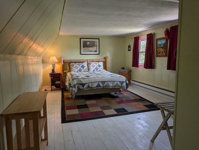 419 Common Rd, Union, ME 04862 - bedroom featuring a baseboard heating unit and wood-type flooring