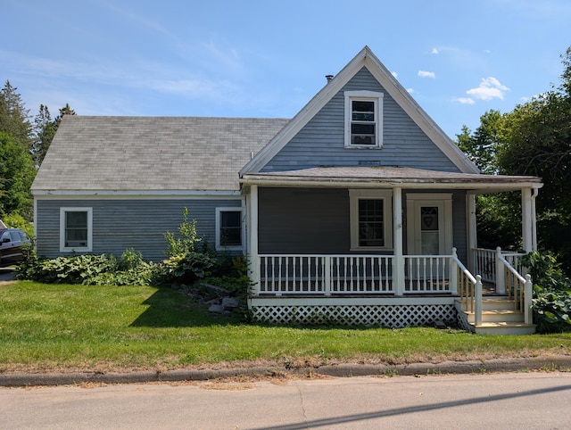 419 Common Rd, Union, ME 04862 - view of front of property featuring a porch, a front yard, and a shingled roof
