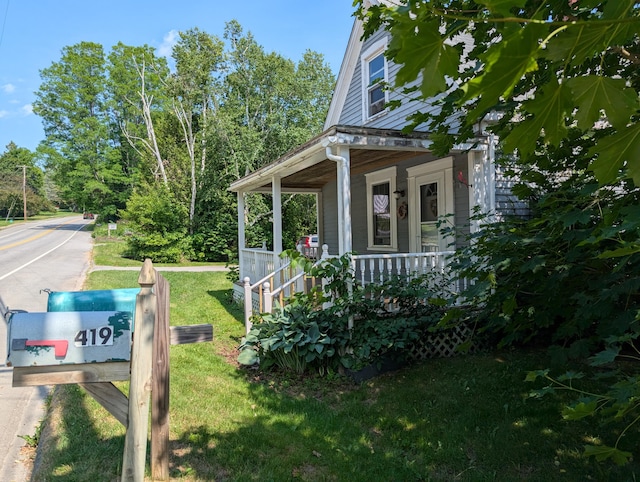 419 Common Rd, Union, ME 04862 - view of side of property with a porch and a yard