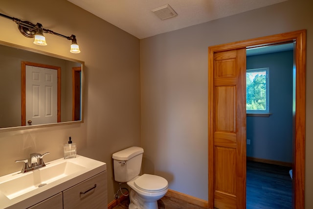 78 Lakeview Rd, Glenburn, ME 04401 - half bathroom featuring vanity and toilet