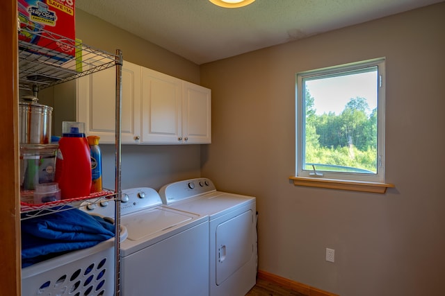 78 Lakeview Rd, Glenburn, ME 04401 - laundry room featuring cabinet space, washer and clothes dryer, and wood finished floors
