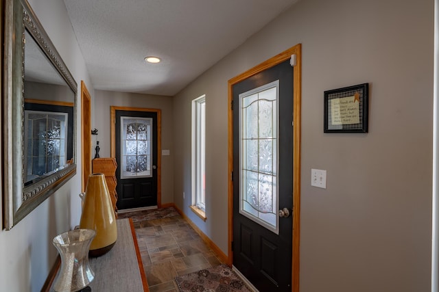 78 Lakeview Rd, Glenburn, ME 04401 - foyer entrance with stone finish flooring, recessed lighting, and a textured ceiling