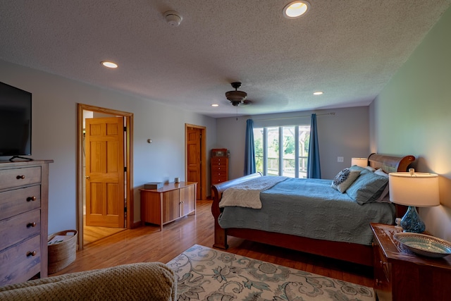 78 Lakeview Rd, Glenburn, ME 04401 - bedroom with wood finished floors, a textured ceiling, recessed lighting, and ceiling fan