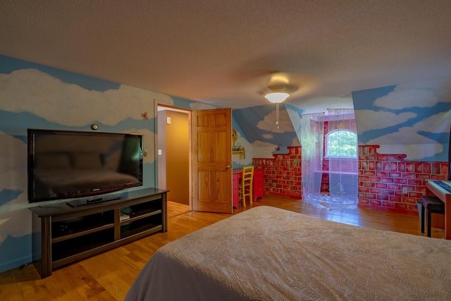 78 Lakeview Rd, Glenburn, ME 04401 - bedroom featuring a textured ceiling and wood finished floors